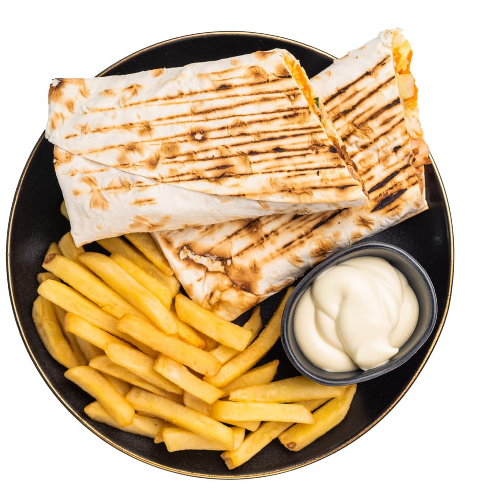 Two grilled wraps with fries and a side of mayonnaise on a black plate at Jean's Cafe.